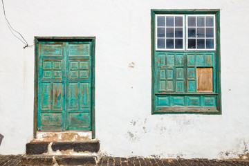 green door and window on white wall background