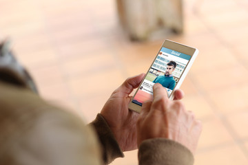 Brown young man smartphone social photo network