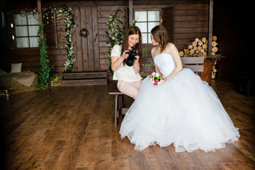 Photographer shows the bride had just taken photos