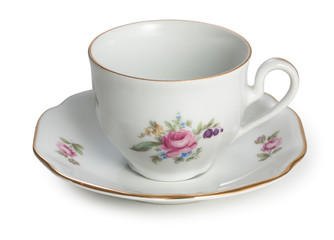 Vintage czech empty porcelain cup for coffee on saucer, old style rich decorated, isolated on a white background.