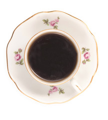 Vintage czech porcelain cup of coffee on saucer, old style rich decorated, isolated on a white background, close up, top view.