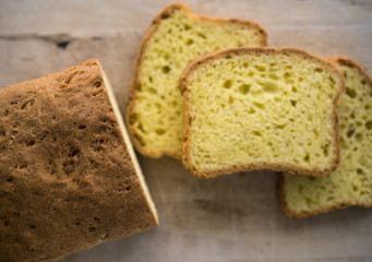 Home-made butter cake sliced on a wooden board. Natural light.