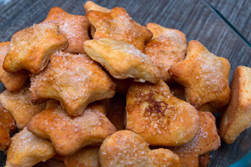 Cookies of different shapes with sugar for a Golden crust.