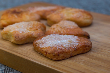 Cookies of different shapes with sugar for a Golden crust.