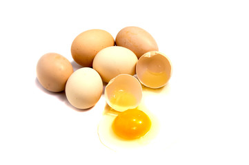 Broken egg in eggshell half and raw egg isolated on white background cutout
