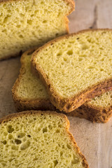 Home-made butter cake sliced on a wooden board. Natural light.