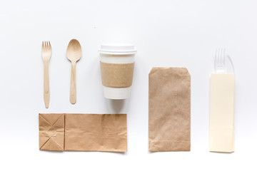 paper bags and plastic cup for take away set top view space for text