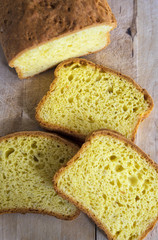 Home-made butter cake sliced on a wooden board. Natural light.