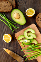 Ingredients for cooking sandwiches with avocado on kitchen table top view