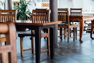 Empty coffee terrace with tables and chairs in Asia.