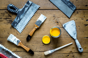 building implements set for repair on wooden background top view