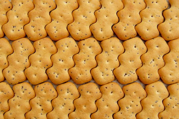 Crackers with poppy seeds, breakfast supper, dry food, background    