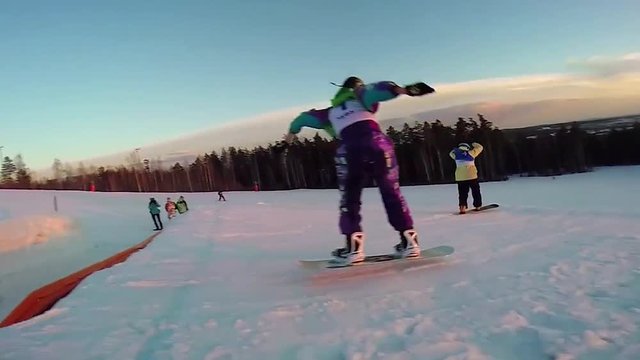 Snowboarder jumping through air with deep blue sky in background. Snowboarder in Flight. Snowboard Jumping in high mountains. Skier jumping