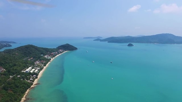 Crystal clear water of the Adaman Sea, Banana Beach Phuket Island, Thailand. Shooting from a height with a quadrocopter, a drone. Aerial shot