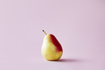 Fresh red pear on hipster pink background, modern style fruit and vegetable food, design layout