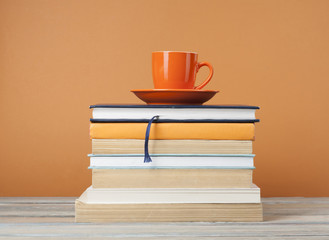 .Cup of tea and books on wooden table.Education background.Back to school.Copy space for text.