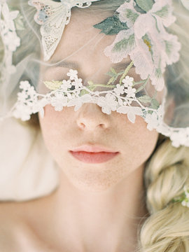 Close up of bride wearing veil