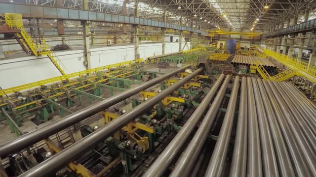 Old factory of auto components production. Warehouse of an aluminum pipes. the production of metal pipes. Pipe welding. Industrial zone, Steel pipelines and equipment. Metal pipes in a warehouse