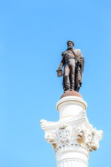 Fototapeta na wymiar Statue of Dom Pedro IV at Rossio Square in downtown Lisbon
