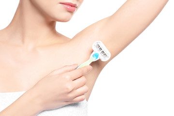 Beautiful young woman with razor on white background, closeup