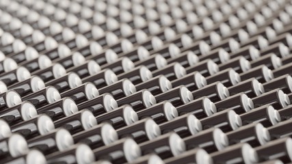 Deeply Layered Lines of Black and White AAA Batteries