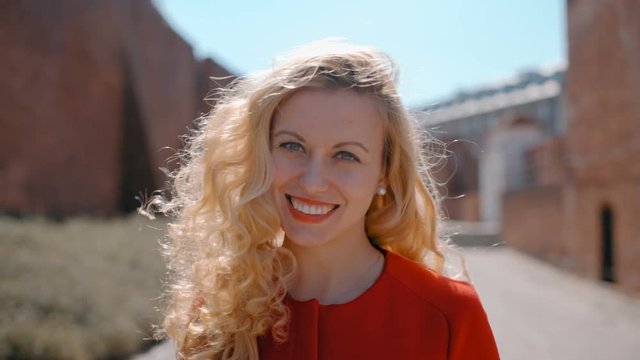 Portrait of Young Attractive Succesful Blonde European Woman Looking to the Camera and Smiling