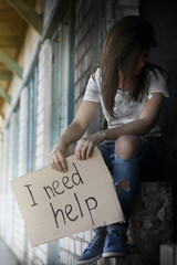 Poor woman begging for help on the street