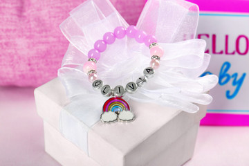 Bracelet with baby name Olivia on white gift box