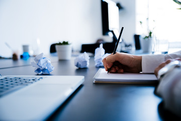 Female hand taking notes. Writing a business plan. Business People Concept