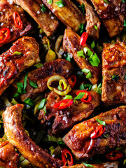 Roasted sliced barbecue pork ribs, seasoned with a spicy basting sauce and served with vegetables.