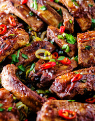 Roasted sliced barbecue pork ribs, seasoned with a spicy basting sauce and served with vegetables.