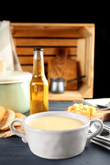 Delicious cream soup in pan on table