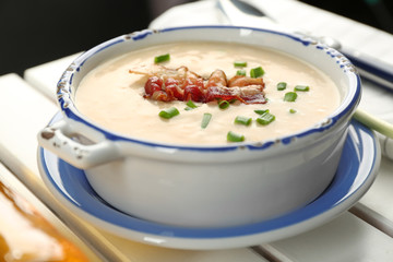Delicious cream soup with bacon and onion, closeup