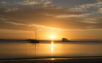 Tasmania, white beach at sunset.