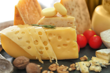 Different types of cheese on table, closeup