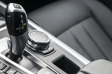 automatic gear stick of a modern car, car interior details