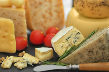 Different types of cheese on table, closeup