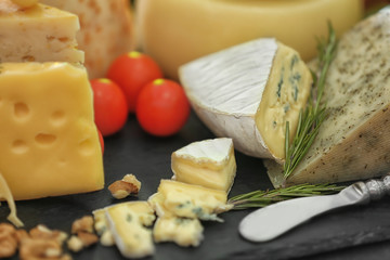 Different types of cheese on table, closeup