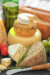 Different types of cheese on table