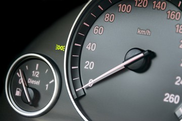 Fototapeta premium Car instrument panel, dashboard closeup with visible speedometer