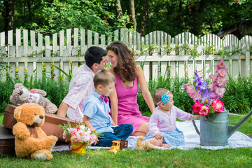 A couple sitting with the children