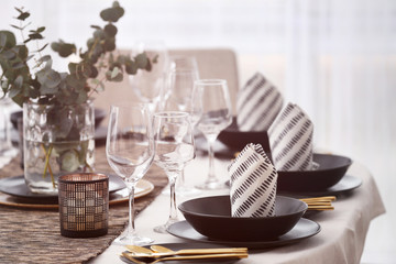 Table with beautiful setting in restaurant, closeup