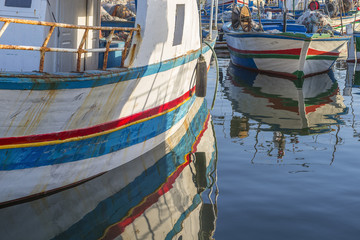 Fototapeta na wymiar Houmt Souk colorful fishing boats with the sea on the background,