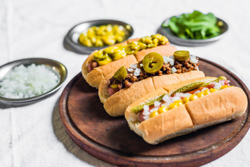 Selection of classic hot dogs against white background