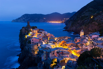 Cinque Terre Vernazza famous view at sunset or sunrise with city light in Italy