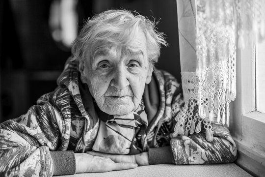 Portrait of an elderly woman. Grandma, black-and-white photo.