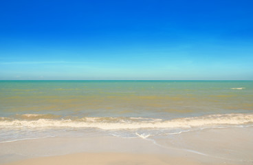 Wave & Sand beach with blue sky background
