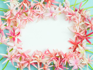 bunch of little lovely flower on white empty paper card over blue background for making card in mother's day, wedding invitation, anniversary or fill word in special occasionally