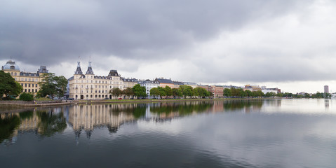 Waterfront city buildings along the canal in Copenhagen, Denmark. Copenhagen city panorama in summer.