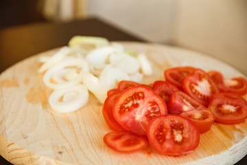 fresh chopped tomatoes and onions on wood board